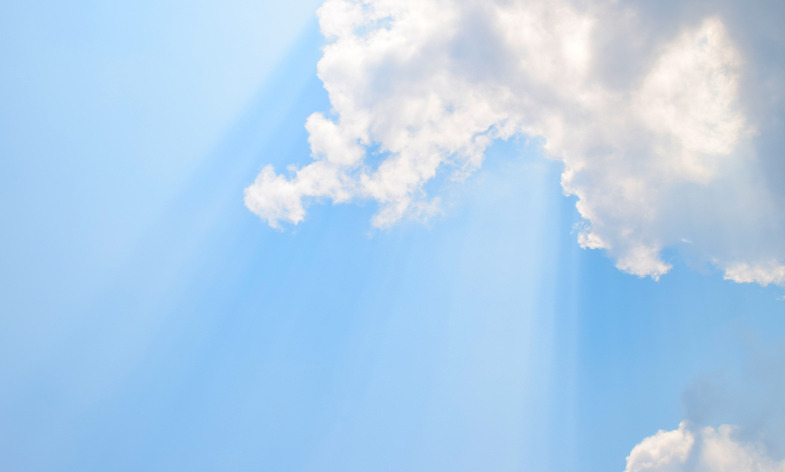 Sunshine and clouds on a blue sky