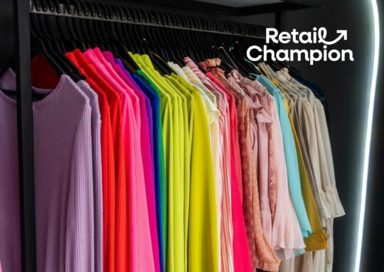 Colourful clothes on a rail in boutique