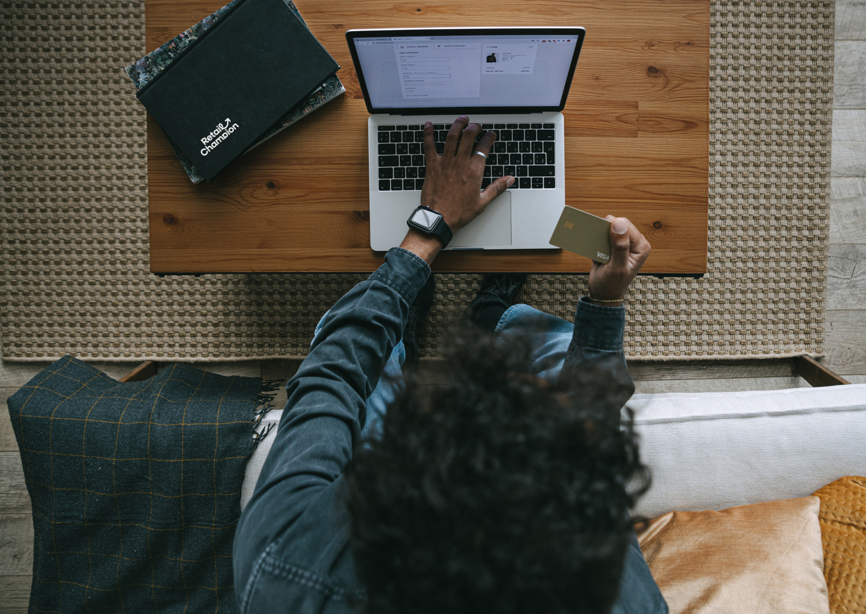 Birdseye view on man with laptop online shopping