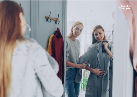 Retail Changing room with two women admiring a coat