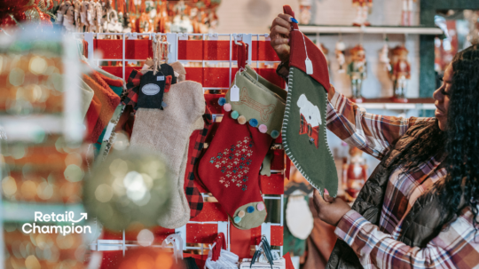 Christmas retail store with customer looking at a stocking